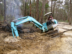 Back-hoe in mudpatch